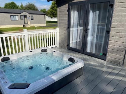 Peace Lodge with Hot Tub Image 2