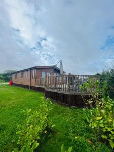 Hedgerow Lodge with Hot Tub Image 1