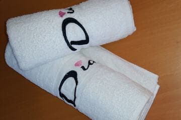 Faceted glass knob reflecting light on a smooth beige wall.