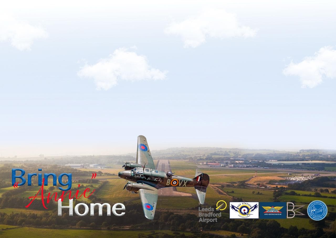 A vintage aircraft flying over the lush green landscape near Leeds Bradford Airport, promoting the "Bring Annie Home" event.