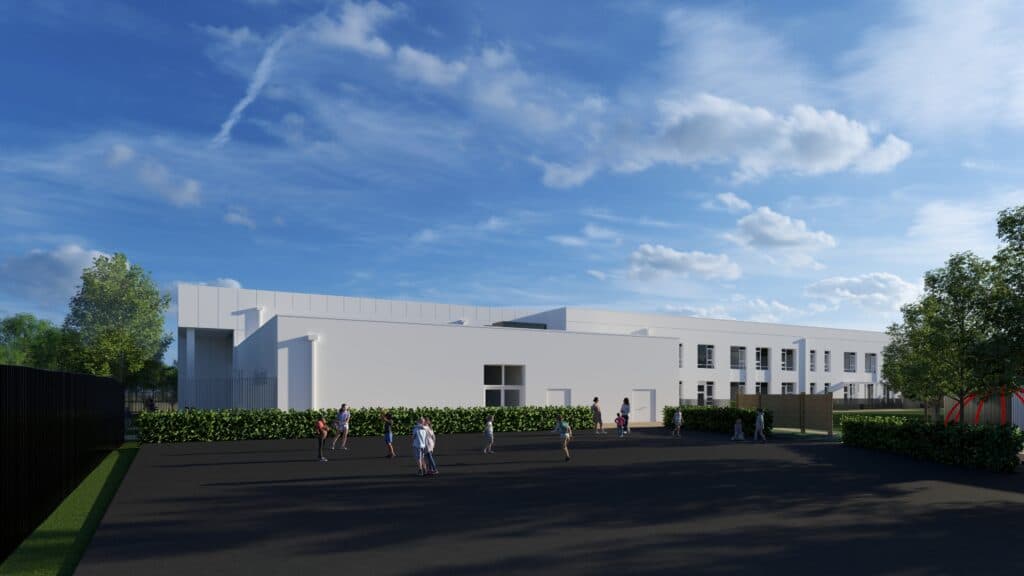 Modern school building with expansive grounds, children playing outside under a bright blue sky in Hull, Yorkshire.