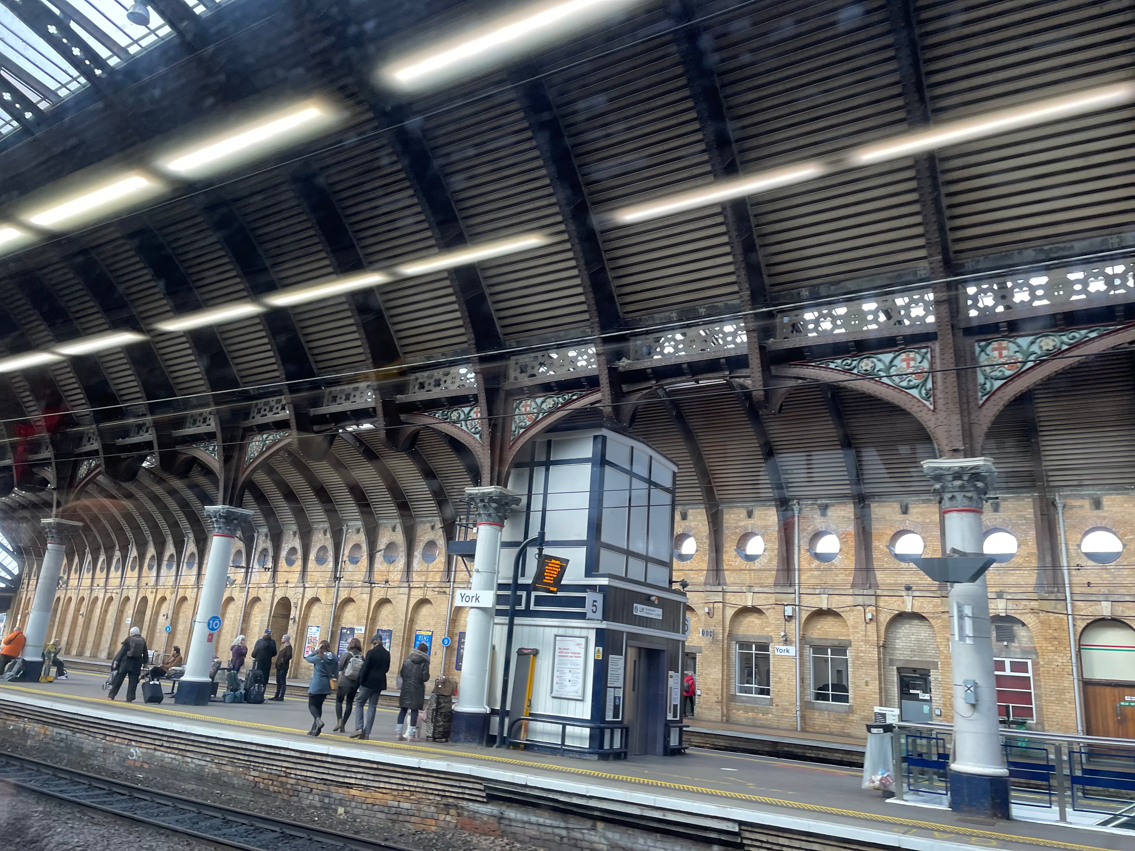 Historic York railway station with arched roof and platforms