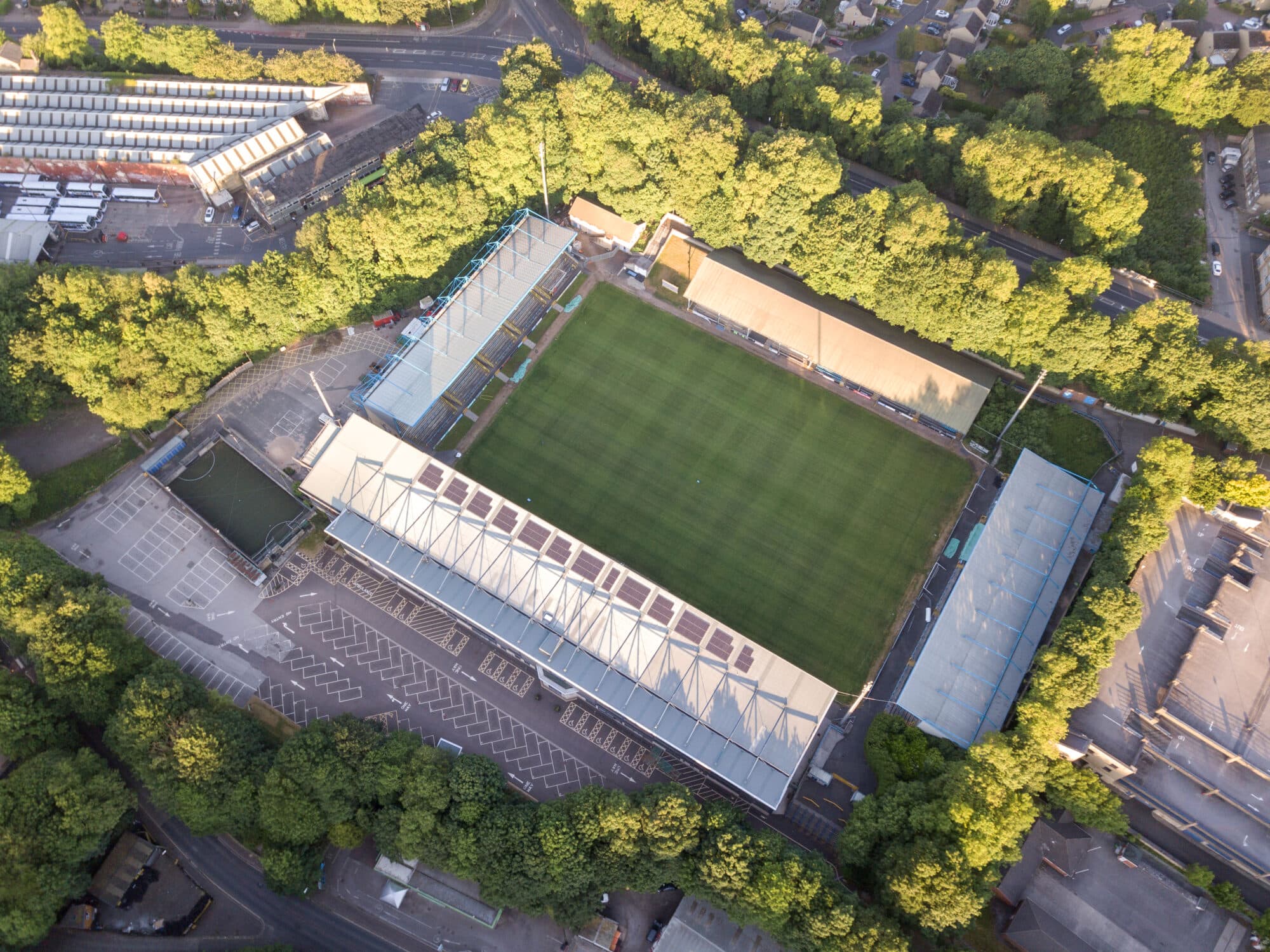 Aerial view of football stadium surrounded by trees
