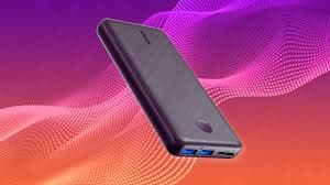 Sleek black power bank with USB ports on colorful background