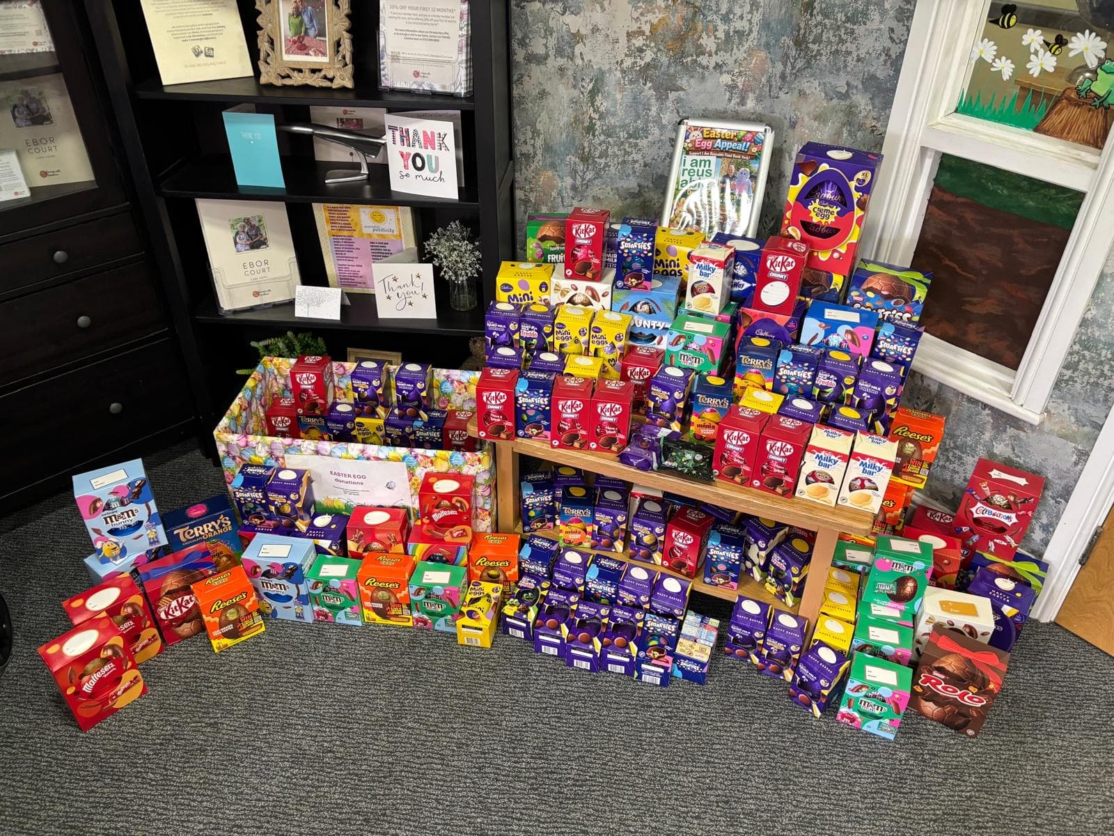 Colorful display of assorted chocolate Easter eggs on shelves