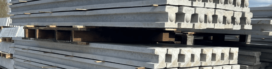 Stacked concrete beams with hollow sections at construction site