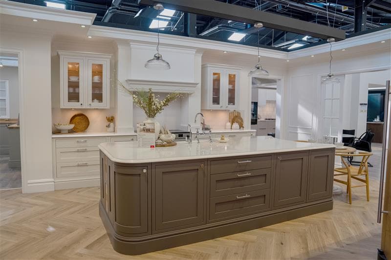Modern kitchen showroom with island and pendant lights