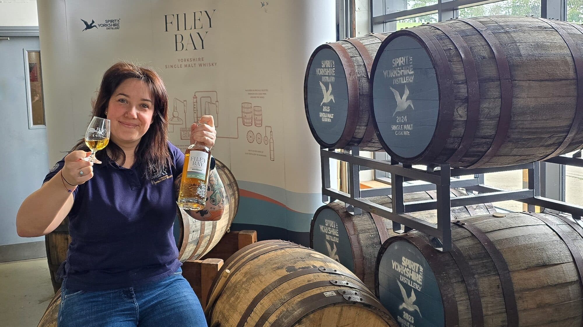 Amy Teasdale with the award winning Filey Bay Peated Finish single malt whisky