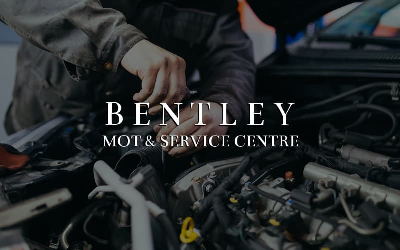Hands working on a car engine with "BENTLEY MOT & SERVICE CENTRE" prominently displayed.