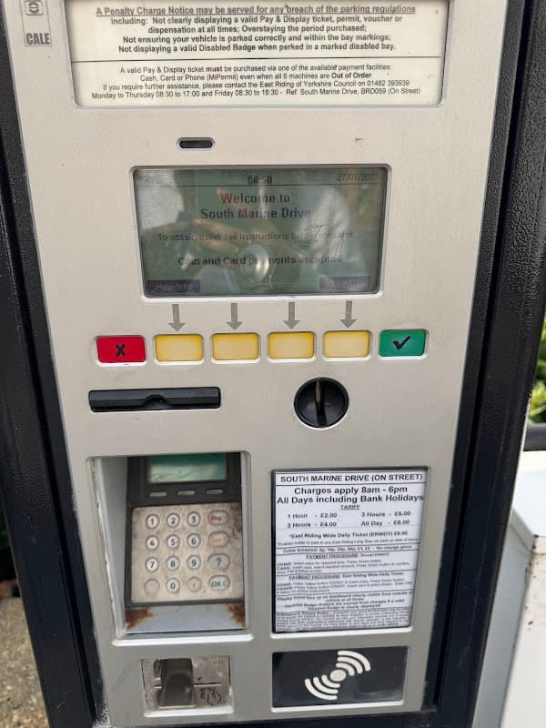 Mer Charging Station kiosk with payment buttons, a screen displaying instructions, and a card reader.