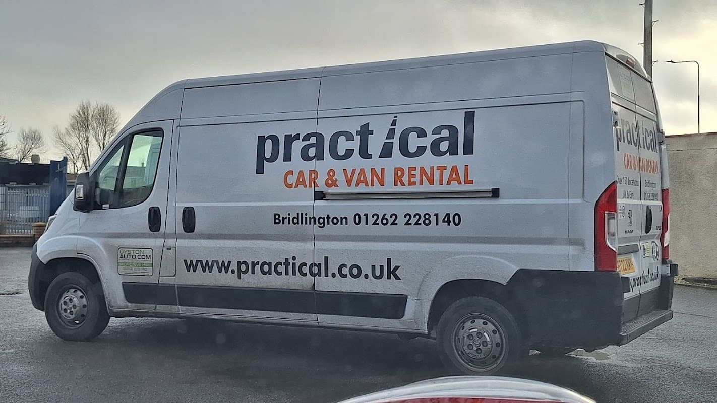 White van with "Practical Car & Van Rental" branding, located in Bessingby, Yorkshire. Contact info visible on the side.