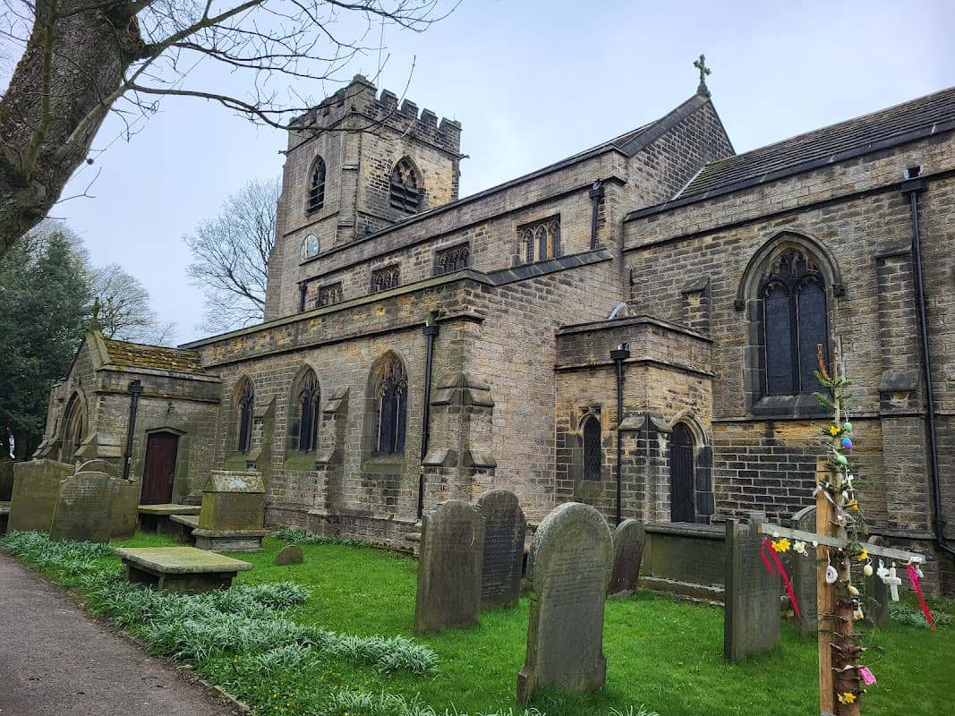 St Mary's Church features a stone exterior, tall tower, stained glass windows, and a graveyard with weathered headstones.