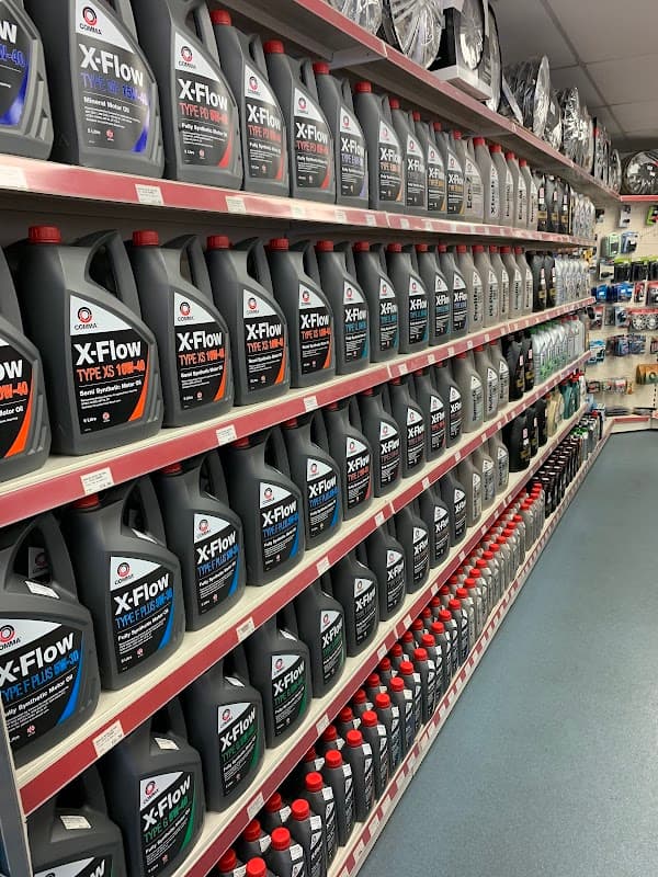 Shelves filled with various motor oils and automotive products at Maxwize Motor Factors in Bradford, Yorkshire.