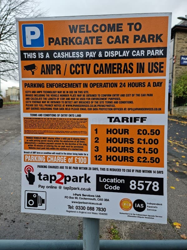 Welcome sign for Parkgate Car Park in Bradford, detailing parking fees, payment options, and enforcement information.