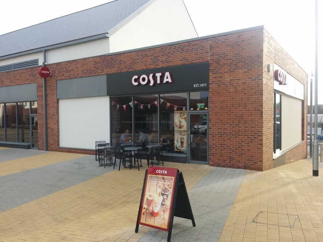 Costa Catterick Garrison storefront with large windows, outdoor seating, and a sign featuring the brand name.