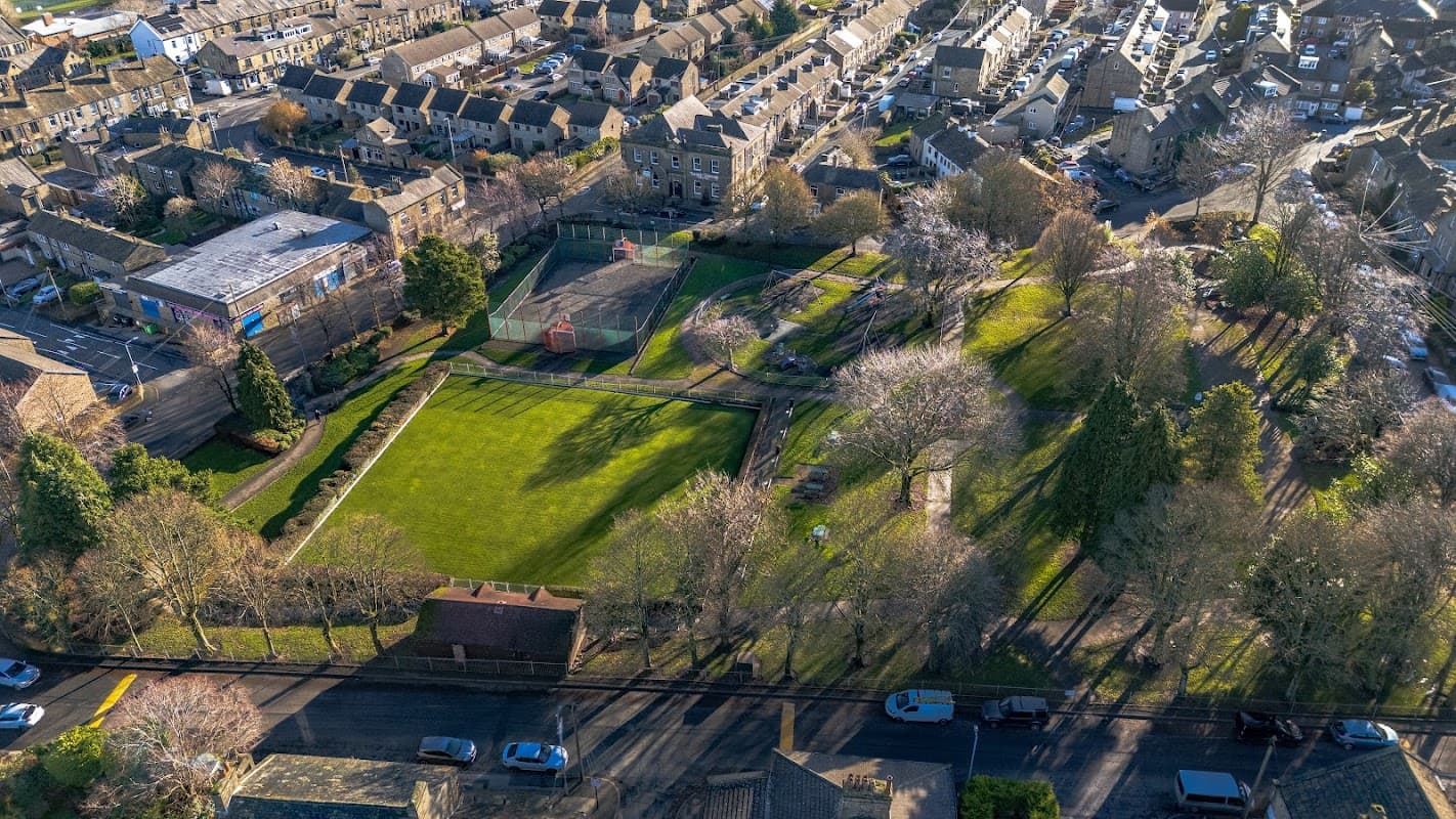 Aerial view of Victoria Park Playground with green fields, trees, and surrounding residential buildings in Clayton, Yorkshire.