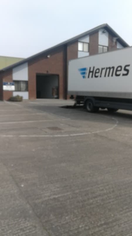 Warehouse building with a Hermes delivery truck parked outside in Copgrove, Yorkshire.