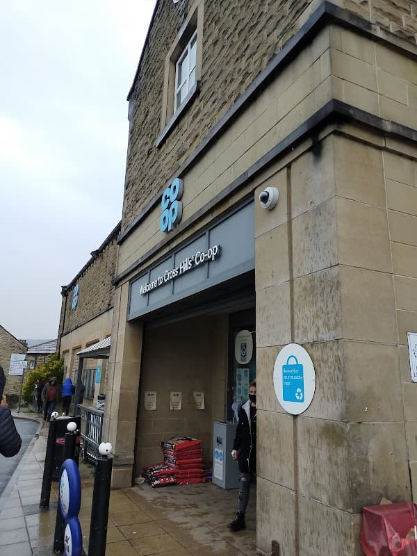 Co-op store entrance on Main Street, Cross Hills, featuring stone architecture and signage.