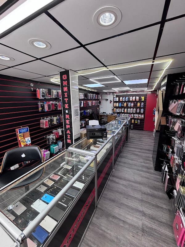 Bright shop interior with display cases, phone accessories, and a repair station in Cross Hills, Yorkshire.