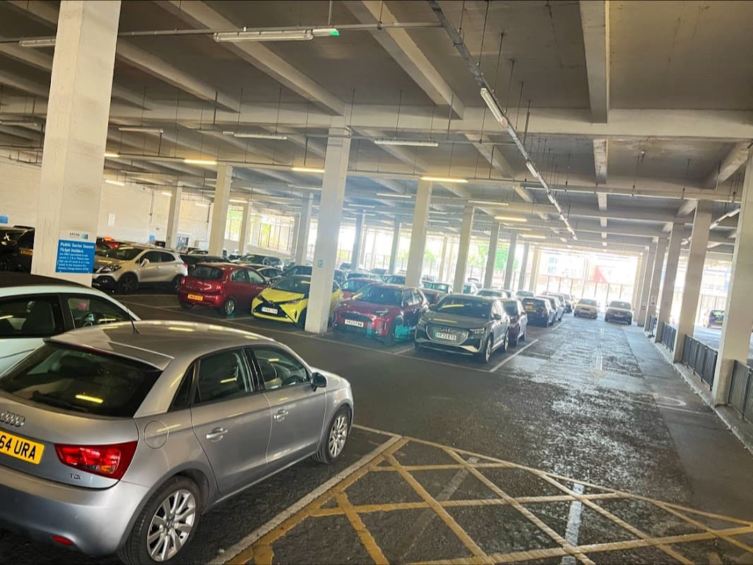 Civic Quarter car park in Doncaster, featuring multiple parked cars under a spacious, well-lit structure.