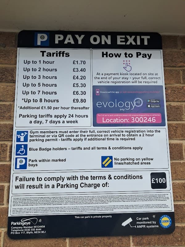 Parking sign detailing tariffs, payment methods, and terms at Frenchgate Rooftop Car Park in Doncaster, Yorkshire.