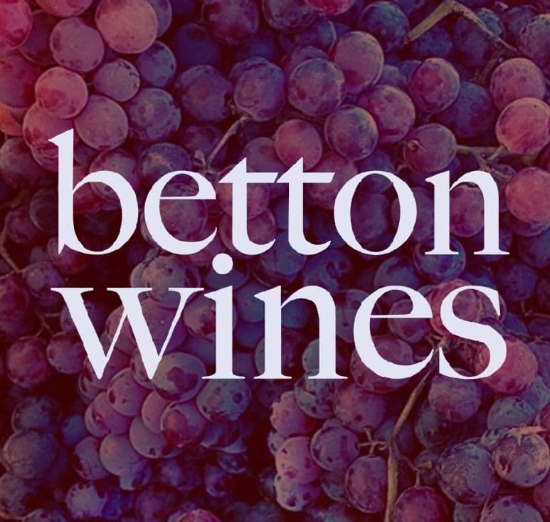 Purple grapes with the text "betton wines" prominently displayed in a stylish font.