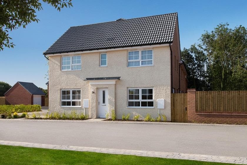 Two-story house with a light-colored exterior, front garden, and on-street parking in a residential area.