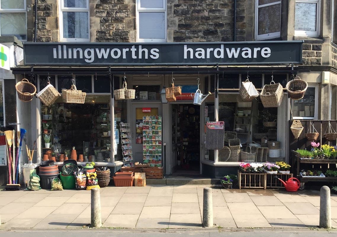 Front of Illingworths Hardware with baskets, pots, and plants outside a stone building in Harrogate, Yorkshire.