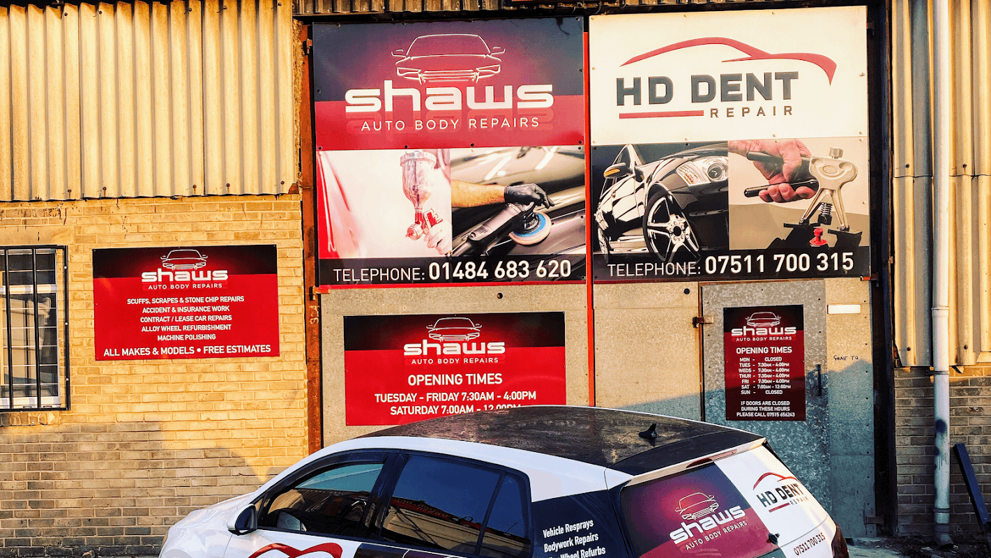 Signage for Shaws Auto Body Repairs and HD Dent Repair, with contact details and opening hours displayed.