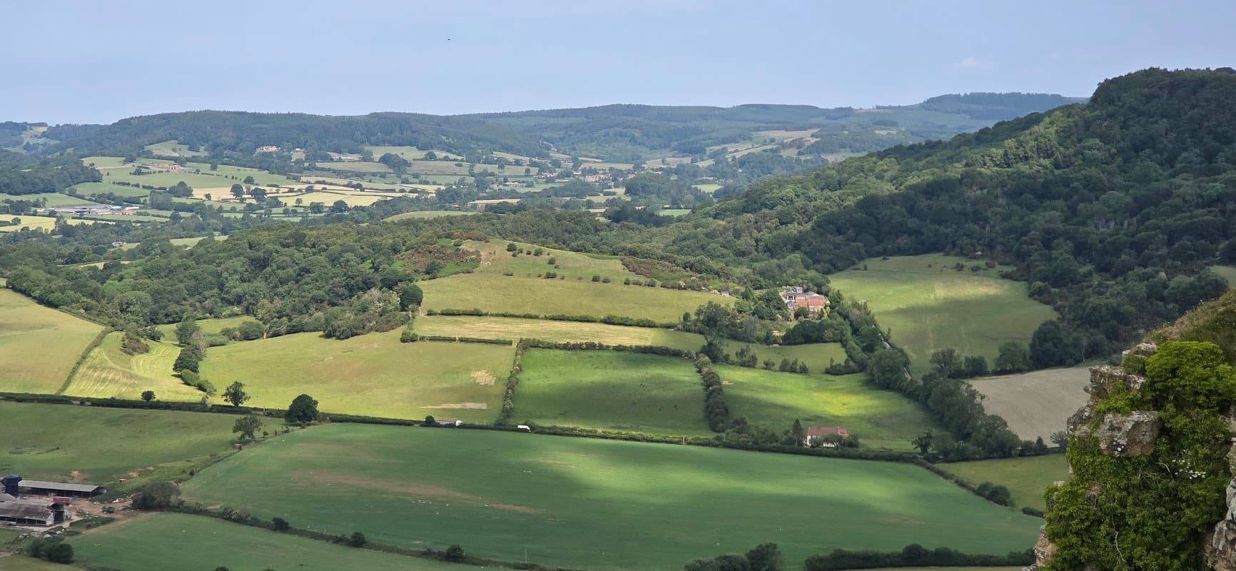 Scenic view of lush green fields and rolling hills from Low Town Bank Road car park in Hood Grange, Yorkshire.