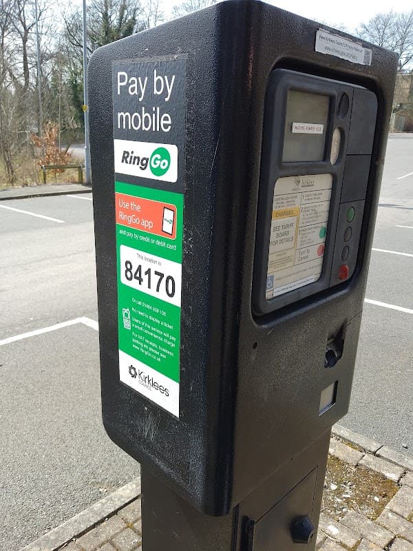 Pay & Display parking meter with instructions for mobile payment via RingGo, located in a parking area.