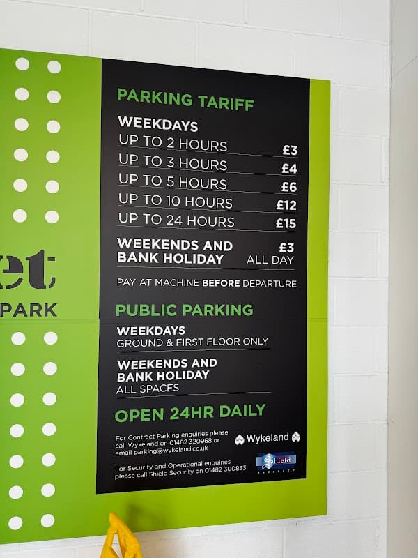 Sign displaying parking tariffs for a multi-storey car park, detailing rates for weekdays and weekends in Hull, Yorkshire.