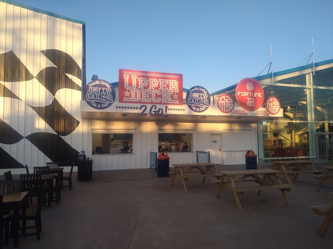 Upper Deck food stall at The Jolly Sailor, featuring colorful signage and outdoor seating in Kirby Misperton.