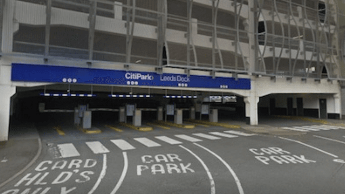 Pay & Display parking entrance at ParkBee CitiPark, Leeds Dock, with marked lanes and signage.