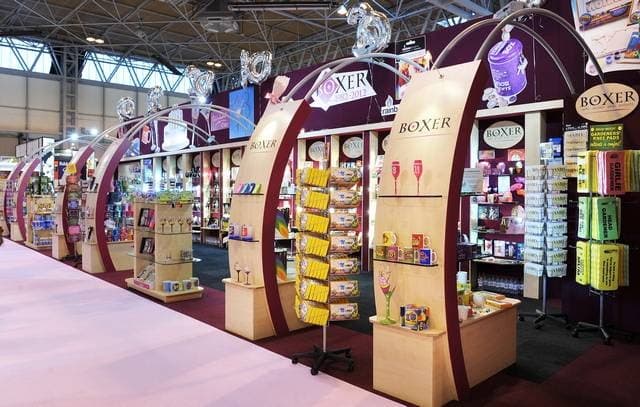 Colorful book displays and shelves in a vibrant bookshop setting, featuring various titles and merchandise.