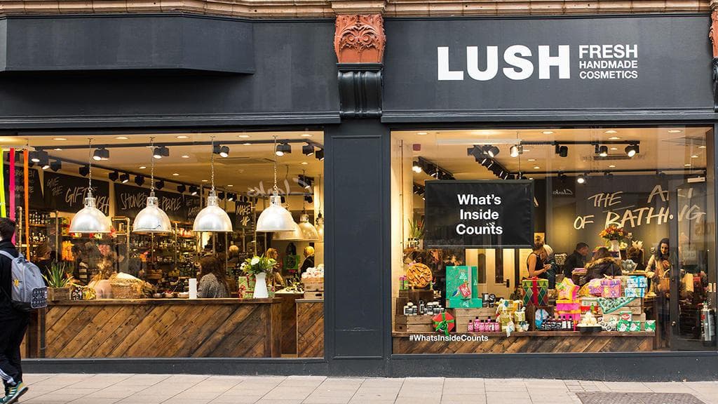 Lush Spa Leeds storefront with large windows, modern decor, and vibrant displays of handmade cosmetics and gifts.