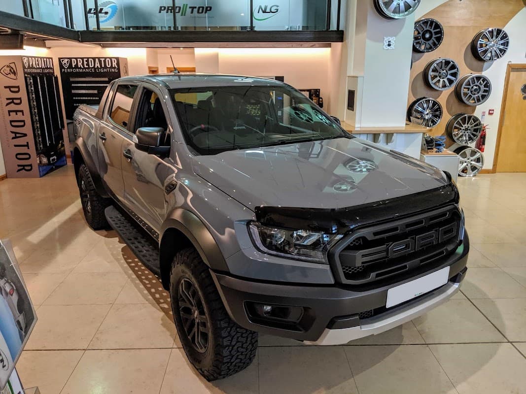Gray Ford Ranger truck parked inside a shop showcasing wheels and accessories in Leeming Bar, Yorkshire.