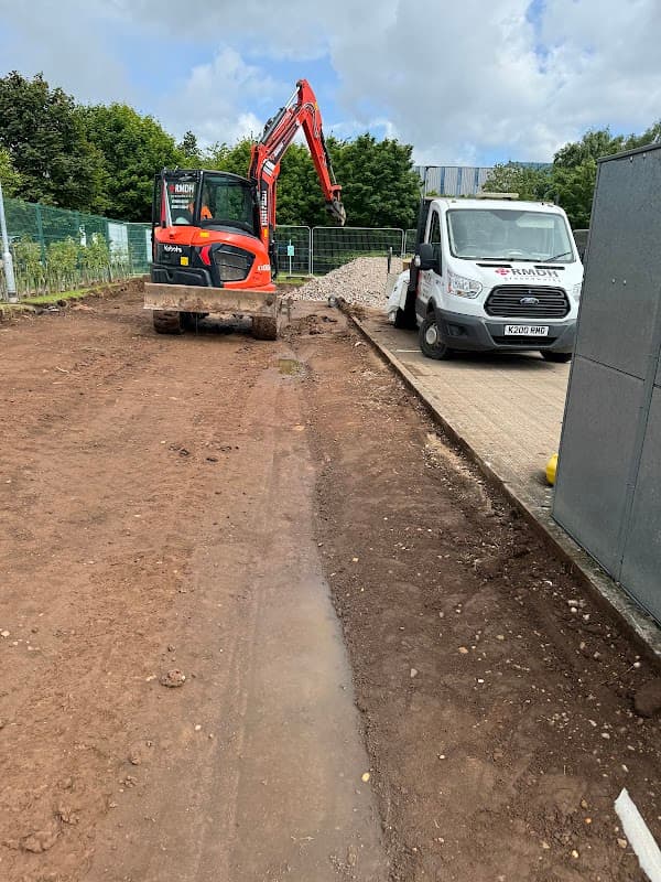 Excavator and delivery van on a construction site at Alpha 1 Machinery, Aven Industrial Park, Maltby, Yorkshire.