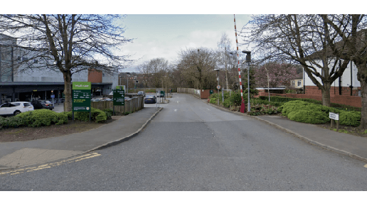 Pay & Display parking area in Meanwood, Yorkshire, with trees lining the road and signage visible.