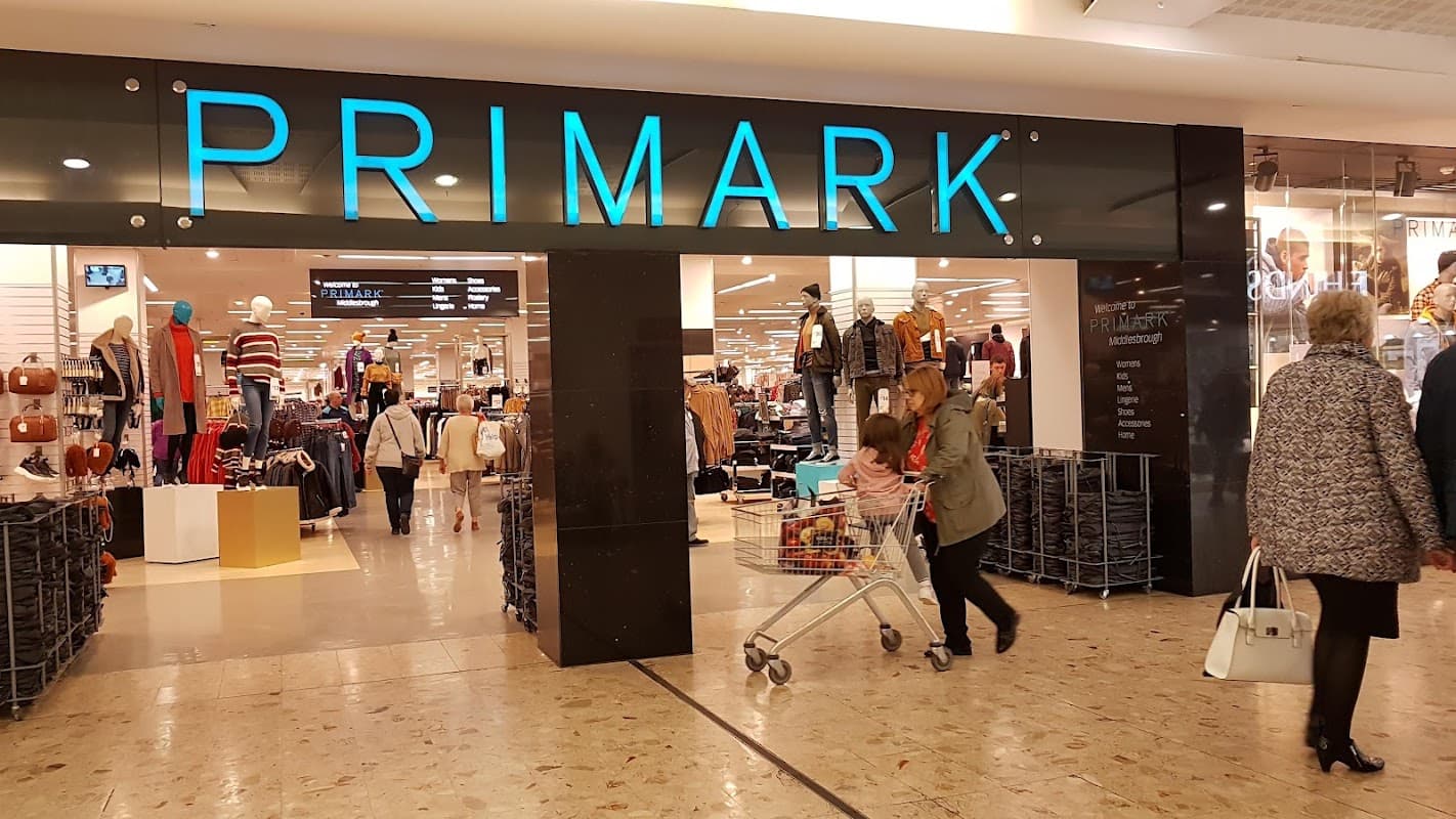 Entrance to Primark at Hill Street Shopping Centre, with shoppers and clothing displays visible inside.