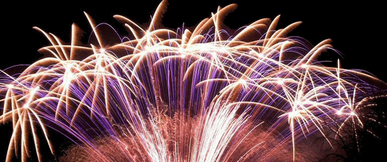 Colorful fireworks bursting in the night sky, creating a vibrant display of light and patterns.