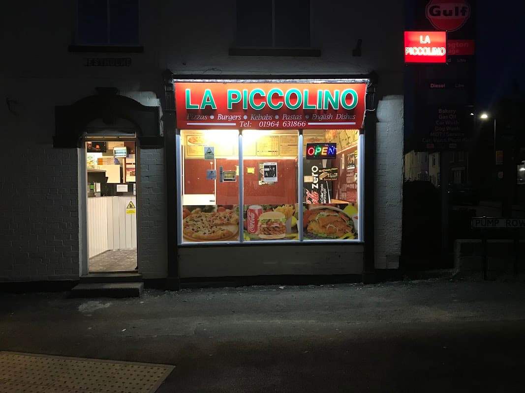 Brightly lit restaurant front with "LA PICCOLINO" sign, showcasing pizza and burger images, and an "OPEN" sign.
