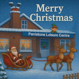 Santa in a sleigh with reindeer outside Penistone Leisure Centre, decorated for Christmas with snow and an elf.