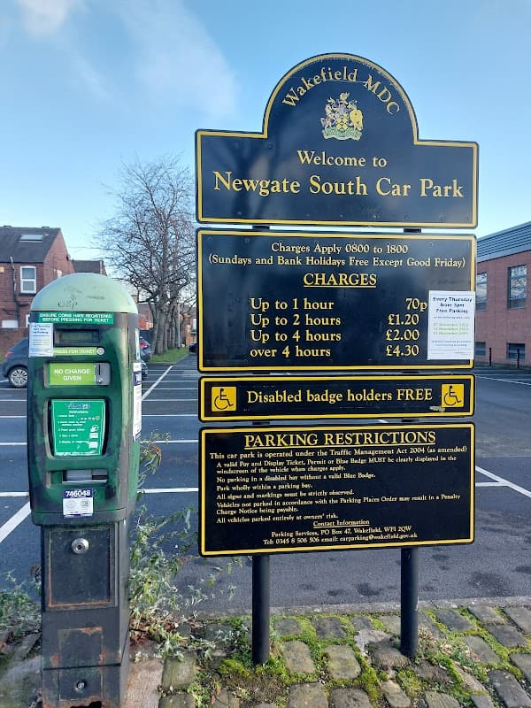 Welcome sign for Newgate South Car Park in Pontefract, featuring parking charges and a pay & display machine.