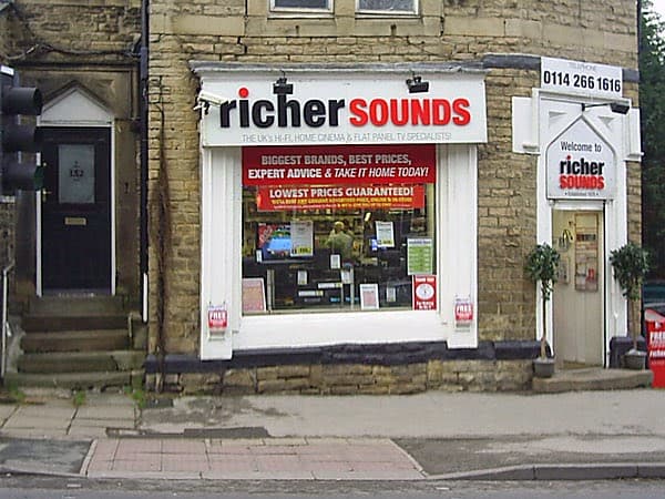Richer Sounds storefront in Sheffield with large windows displaying home audio equipment and promotional signage.