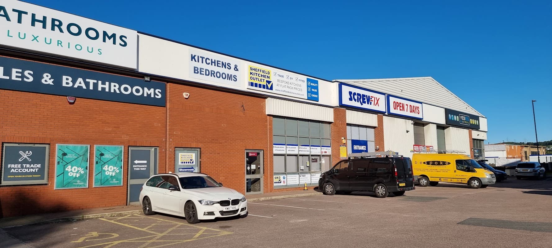 Screwfix store in Hillsborough, Sheffield, with parked vehicles and signage for kitchens, bathrooms, and trade accounts.