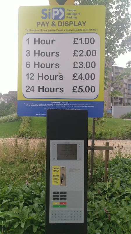Pay & Display parking sign with pricing for 1, 6, 12, and 24 hours at Park Hill Flats, Sheffield.