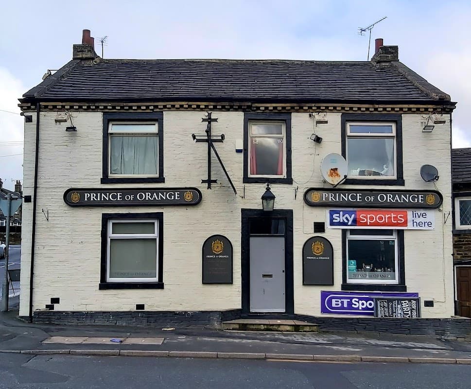Bar exterior with "Prince of Orange" signage, satellite dishes, and sports broadcasting logos in Shelf, Yorkshire.
