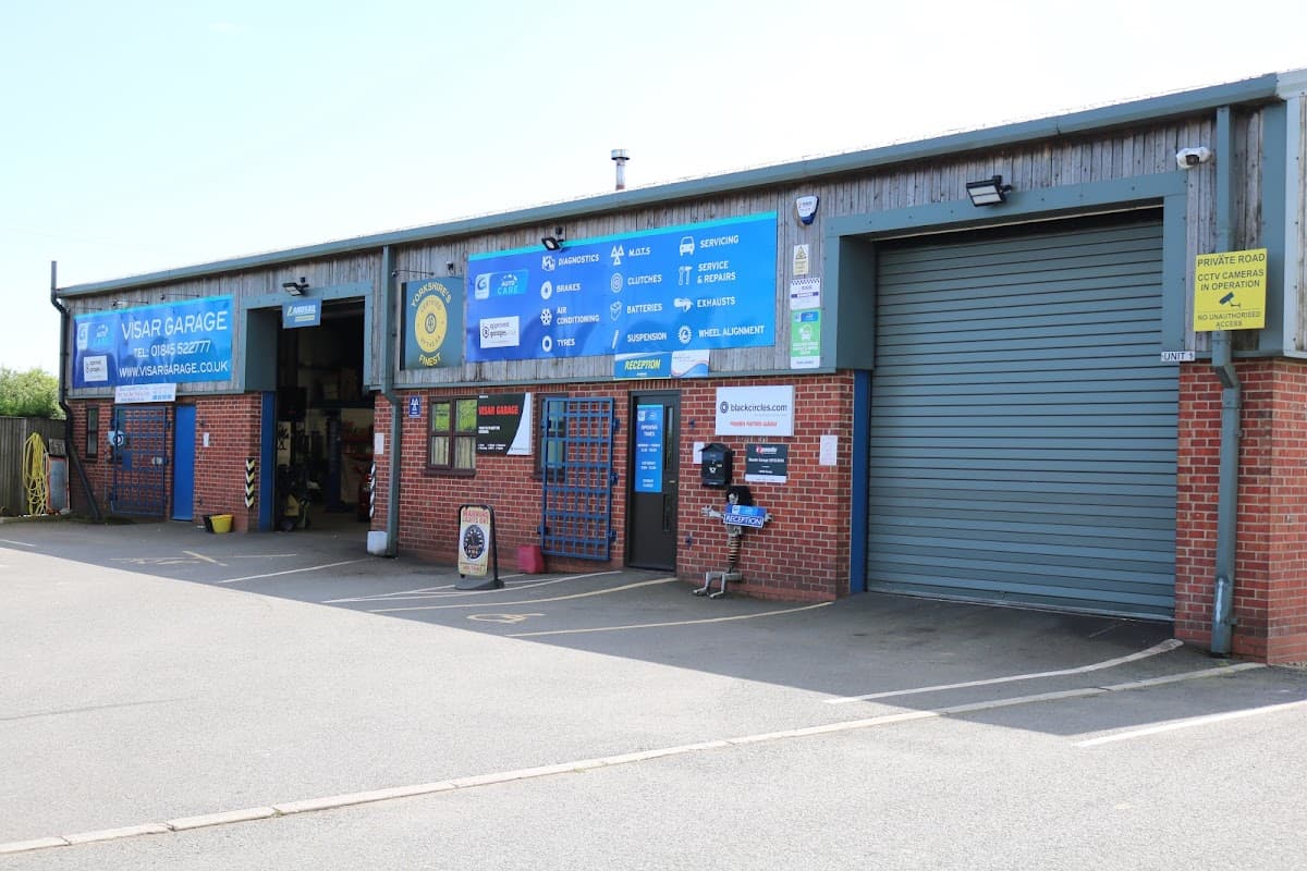 VISAR Garage with blue signage, roller door, and entrance displaying various car part services in Sowerby, North Yorkshire.