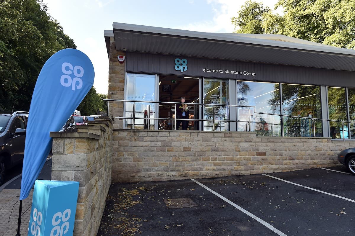 Co-op Food store in Steeton, featuring a welcoming entrance, blue signage, and parking area.